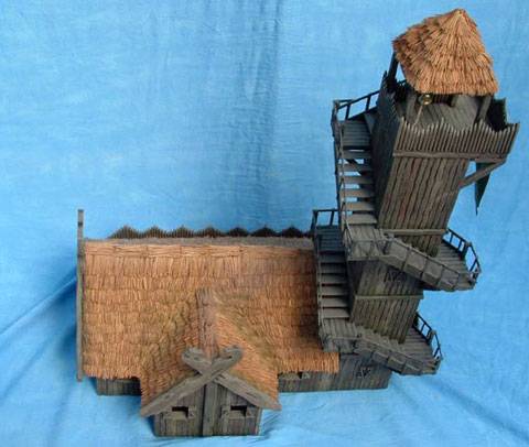 Impresionante construccion de una casa fortaleza con una atalaya muy alta adosada en Rohan. 