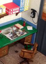 Magn&iacute;fico diorama donde se recrea todo un taller mec&aacute;nico al completo de los a&ntilde;os 60 con un veh&iacute;culo incluido, nuestro famoso seicientos. La obra corre a cargo de Emilio, un m&aacute;quina. 